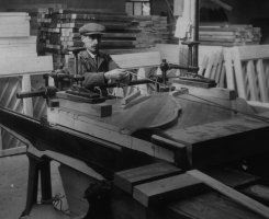 Inside the Brasted piano factory. Cutting the back to size.