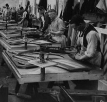 Inside the Brasted piano factory. Stringing.