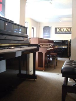 Inside Carstairs Pianos, Roper Road showroom.