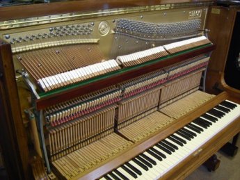 A restored 1920's Steck upright piano.