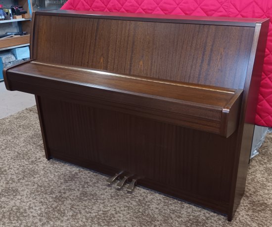 Kemble Cambridge 10 upright piano in a  satin mahogant finish.