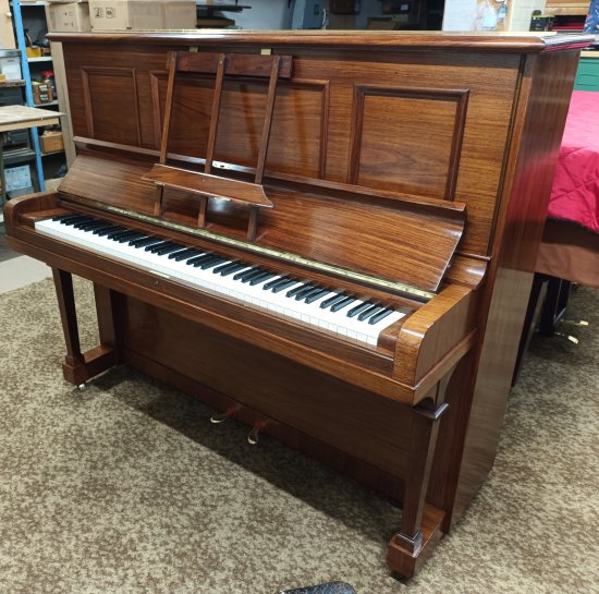Steinway 'Vertegrand' upright piano in a polished rosewood finish.